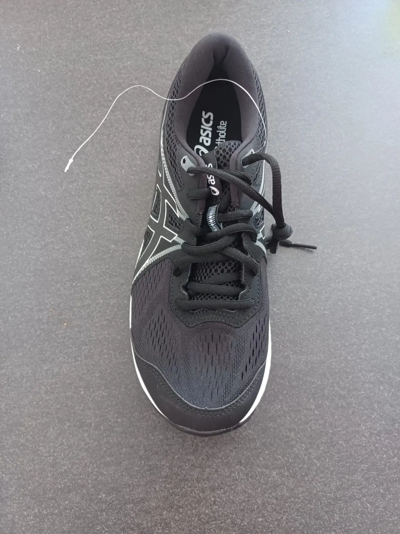 Chaussure de running Asics noire en mesh et synthétique, neuve avec étiquette, présentant des détails blancs